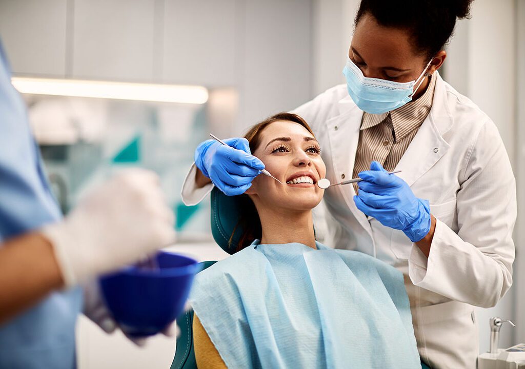 young-smiling-woman-having-dental-exam