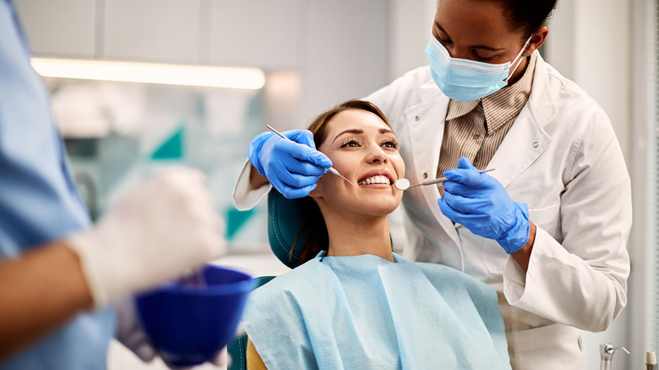 young-smiling-woman-having-dental-exam